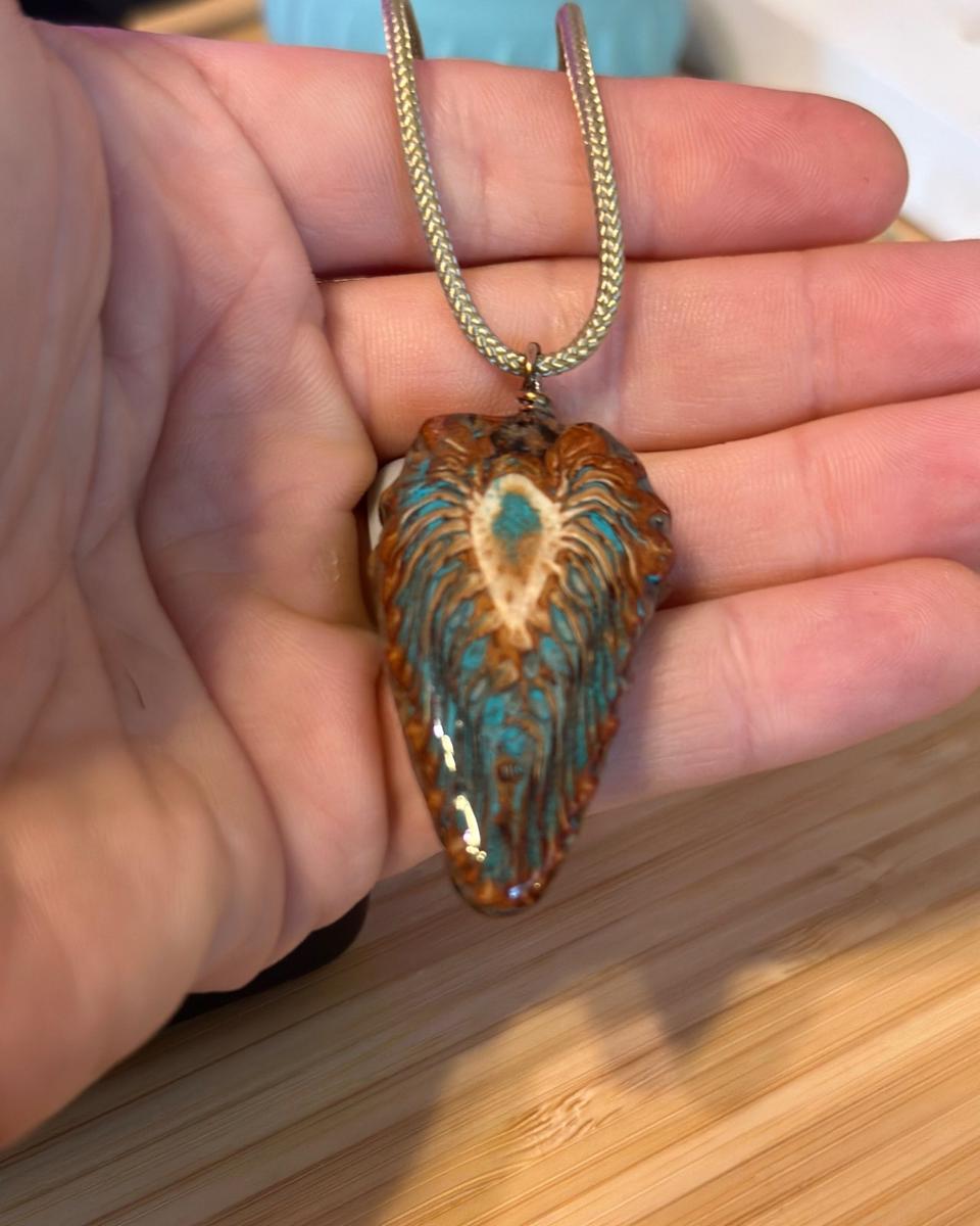 Pendant in hand for size